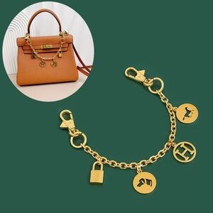 Gold purse chain with iconic horse, lock, H charms